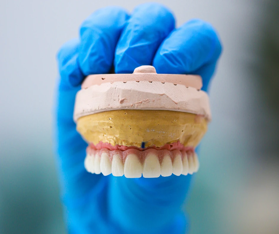 Dentist holding teeth