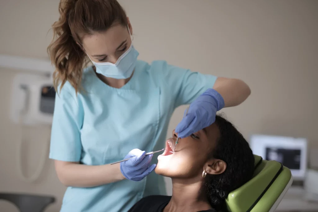 Dental expert inspecting patient's mouth